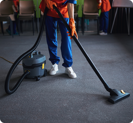 cleaning-lady-using-a-canister-vacuum